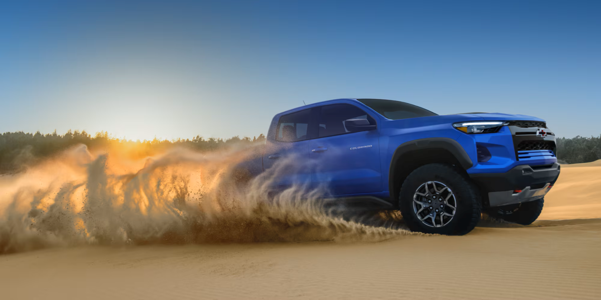 The 2026 Chevrolet Colorado driving in sand
