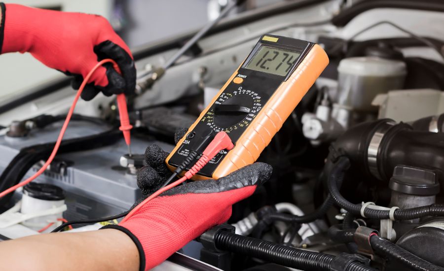 Chevrolet service technician testing a battery