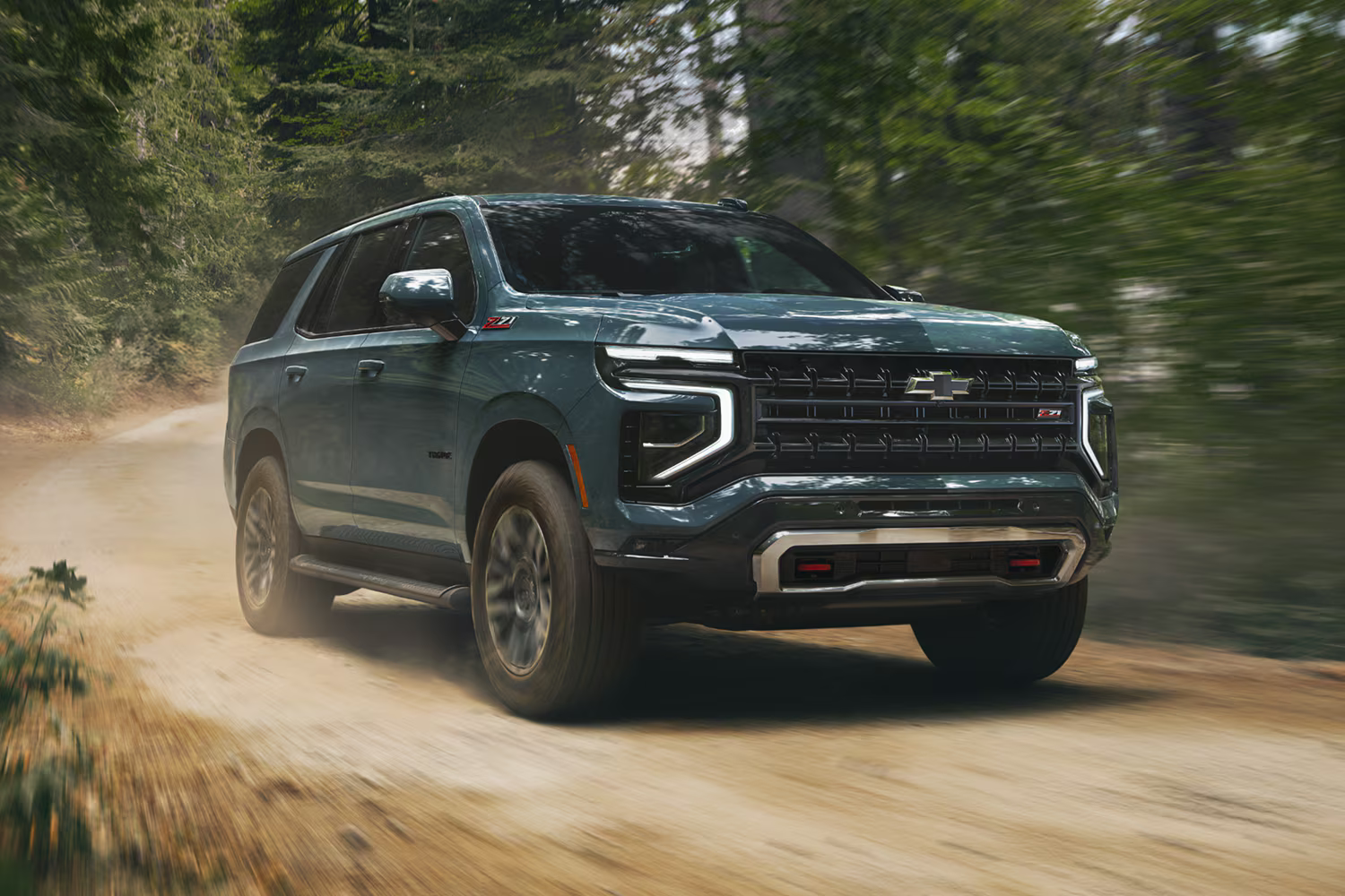 The 2026 Chevrolet Tahoe driving fast on trail