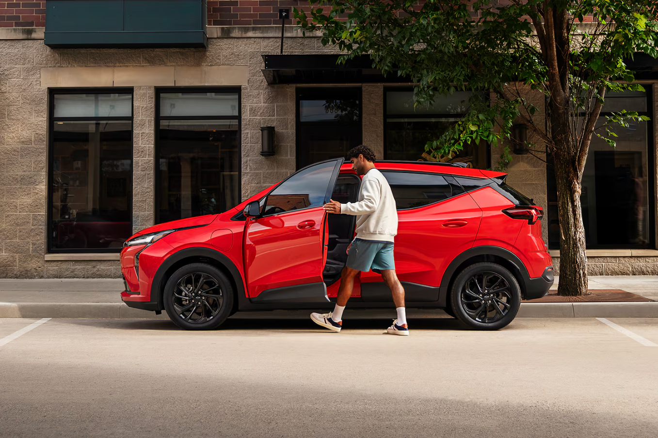 Exterior view of the 2027 Chevrolet Bolt EV Owner Opening Driver Door