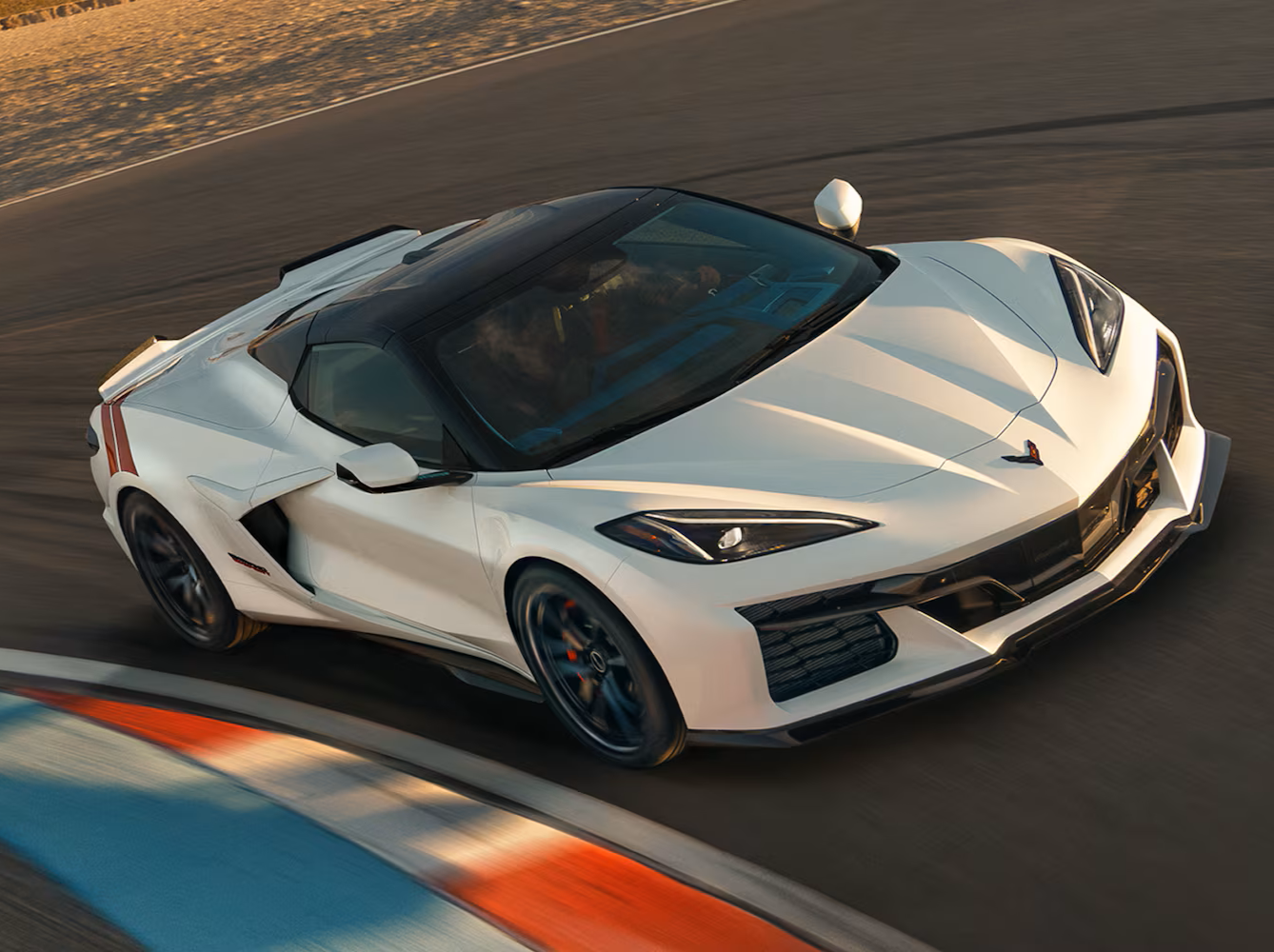 White Chevrolet Grand Corvette Driving Fast on the Track