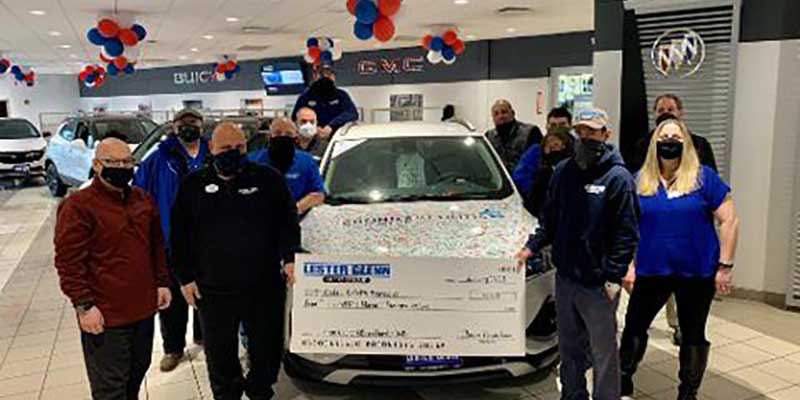 Lester Glenn donating money for charity