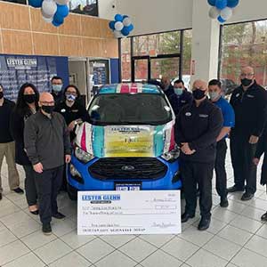 Lester Glenn donating money for charity